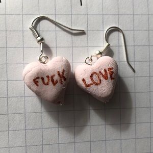 Cute “fuck love” conversation heart earrings